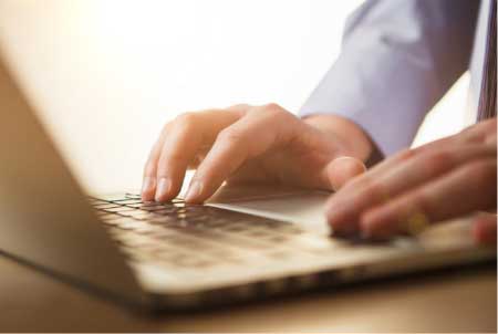 Man typing on an intake form